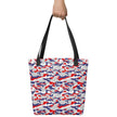 Hand holding a Buffalo football camouflage tote bag featuring an original red white blue and grey team-color pattern, standout fan accessory for everyday use.