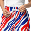 Close-up of lightweight Buffalo football joggers showing adjustable drawstring detail and signature red white and blue striped pattern.