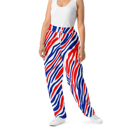 Woman wearing Buffalo football jogger pants featuring original red white and blue signature stripe print, comfortable lightweight fit with stylish game day look.”