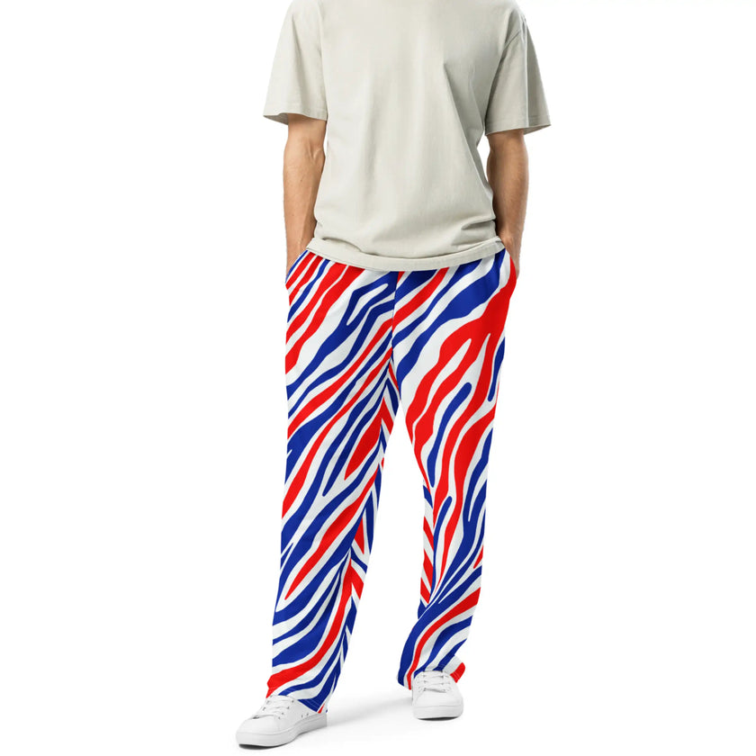 Man wearing Buffalo football jogger pants featuring original signature stripe design in bold red white and blue, premium casual apparel for Buffalo fans.