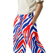 Left side view of man wearing Buffalo striped joggers with unique football-inspired print, lightweight fabric, and modern relaxed fit.