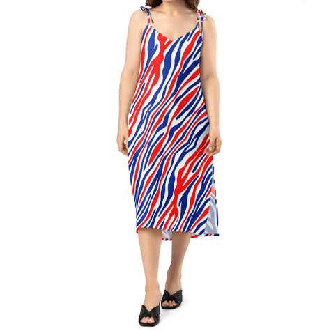 Woman wearing signature Buffalo football striped chiffon slip dress with graceful movement, lightweight feminine style, and eye-catching red, white, and blue original pattern.