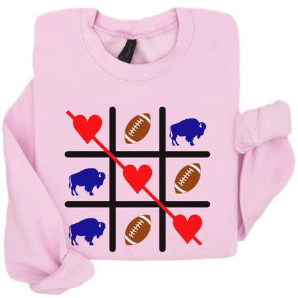 Pink Buffalo Valentine sweatshirt flat lay with football tic tac toe graphic and love theme