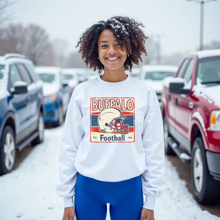 Female model wearing white Retro Buffalo Football sweatshirt outside in snow, showing vintage 1960s helmet design.