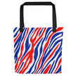 Back view of Buffalo football tote bag with red white and blue striped all-over-print design and durable black handles.