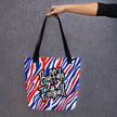 Hand holding Buffalo football tote bag featuring red white and blue striped design and Buffalo Football lettering, stylish game day bag for shopping and everyday use.