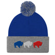 Blue and grey pom pom winter beanie featuring embroidered red white and blue Buffalo football trio silhouettes, Buffalo themed winter hat design.