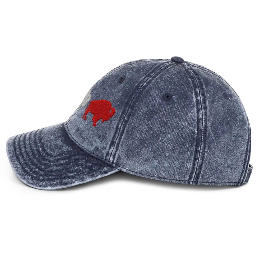 Navy cotton twill Buffalo cap left side view showing embroidered Buffalo football trio design in red white and blue colors, vintage style hat.