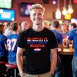 Male model wearing black Buffalo Mafia t-shirt at the bar, buffalo silhouette with red white blue gradient design, bold Buffalo football fan game day vibe.