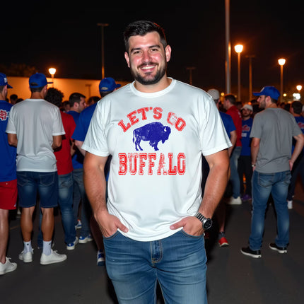 Man wearing white Let’s Go Buffalo football t-shirt at a nighttime tailgate party, showing football fan energy and Buffalo pride.