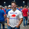Buffalo football t-shirt worn by male model in white, featuring distressed blue lettering and a red buffalo graphic at center chest, confident game day style.