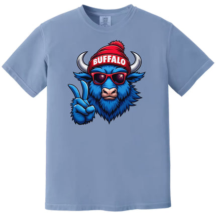 Light blue t-shirt with a blue buffalo wearing a red beanie and sunglasses, giving a peace sign.