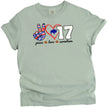 Green Buffalo quarterback peace Love 17 football tee with striped peace sign, red heart, and number graphic, flat lay on white background.