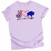 Peace Love Buffalo t-shirt in light purple with peace sign, red heart and blue buffalo graphic, flat lay on white background.