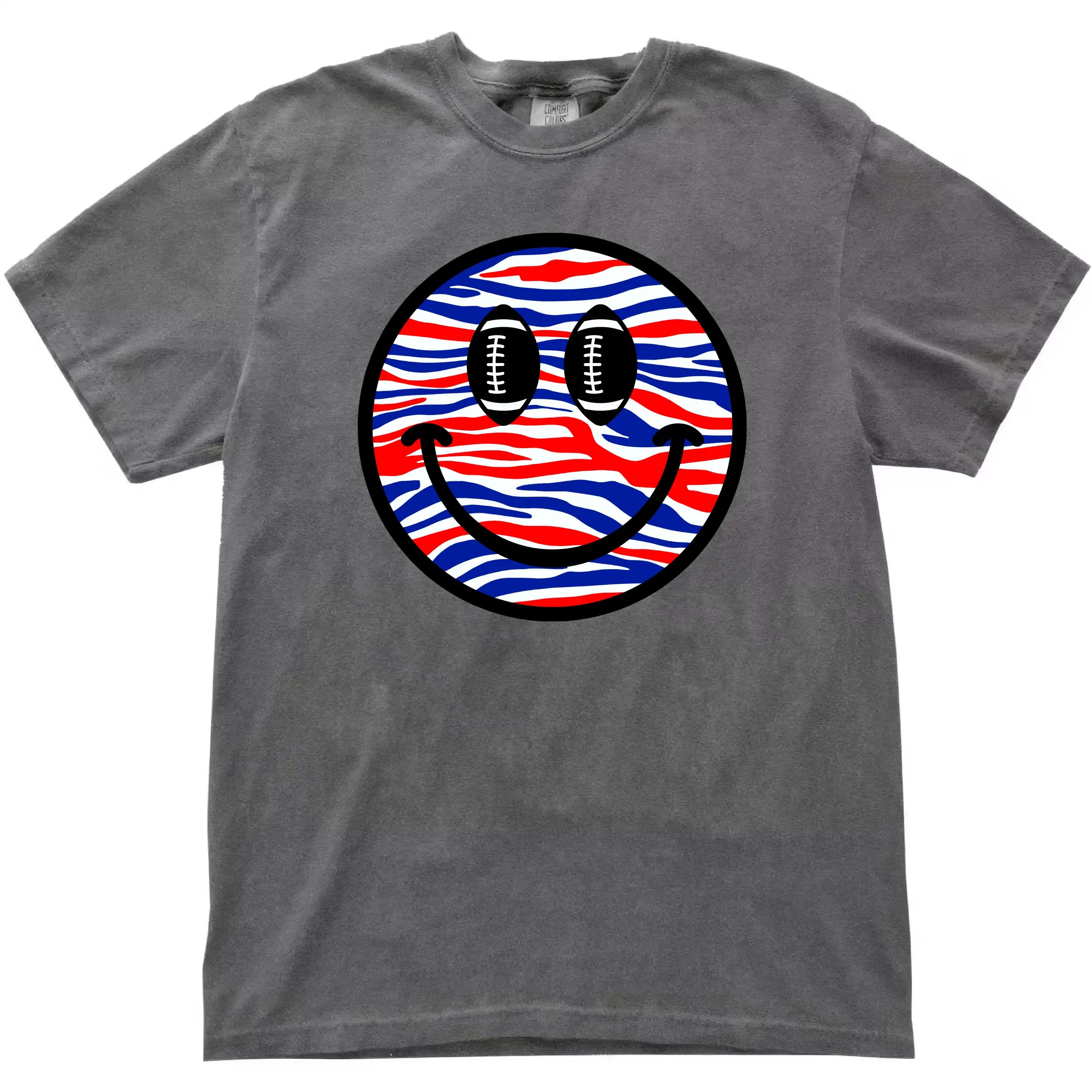 Smiling face football graphic tee in grey, Buffalo-style red white blue striped design with football eyes, game day fan shirt.
