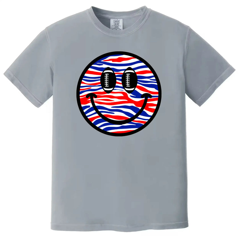 Buffalo football fan tee in light grey, smiling face design with patriotic stripes and football eyes, casual game day shirt.