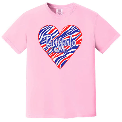 Buffalo football women’s t-shirt with striped heart graphic and bold lettering, pink tee flat lay on white background.
