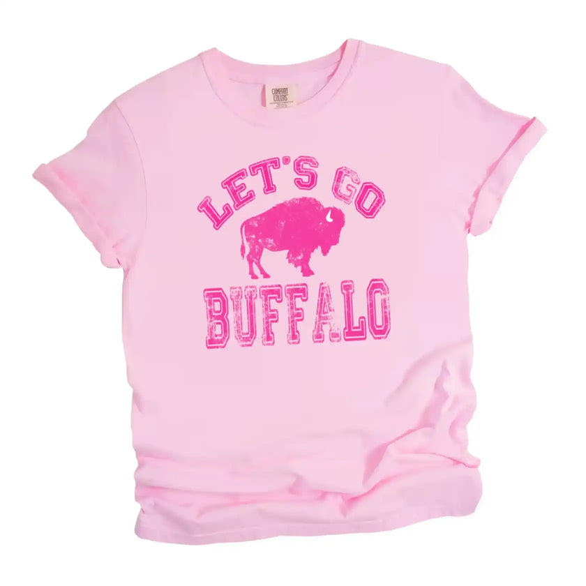 Pink ‘Lets Go Buffalo’ t-shirt featuring hot pink lettering on light pink tee design on white background.