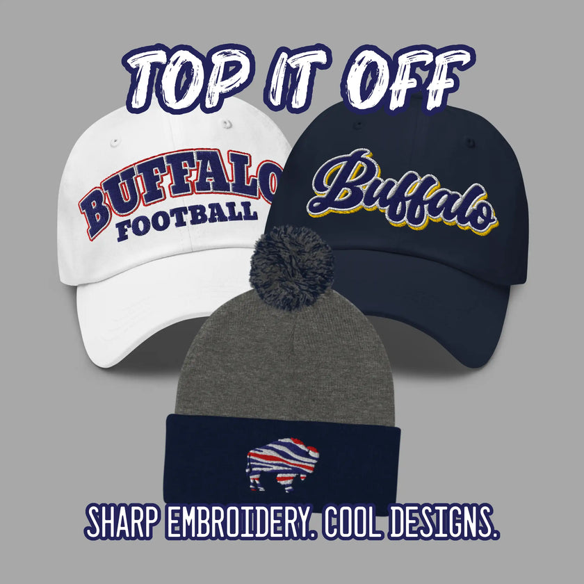 Buffalo football and hockey hats including two embroidered dad hats and a Buffalo winter pom pom beanie with Buffalo NY and team-inspired designs on grey background.