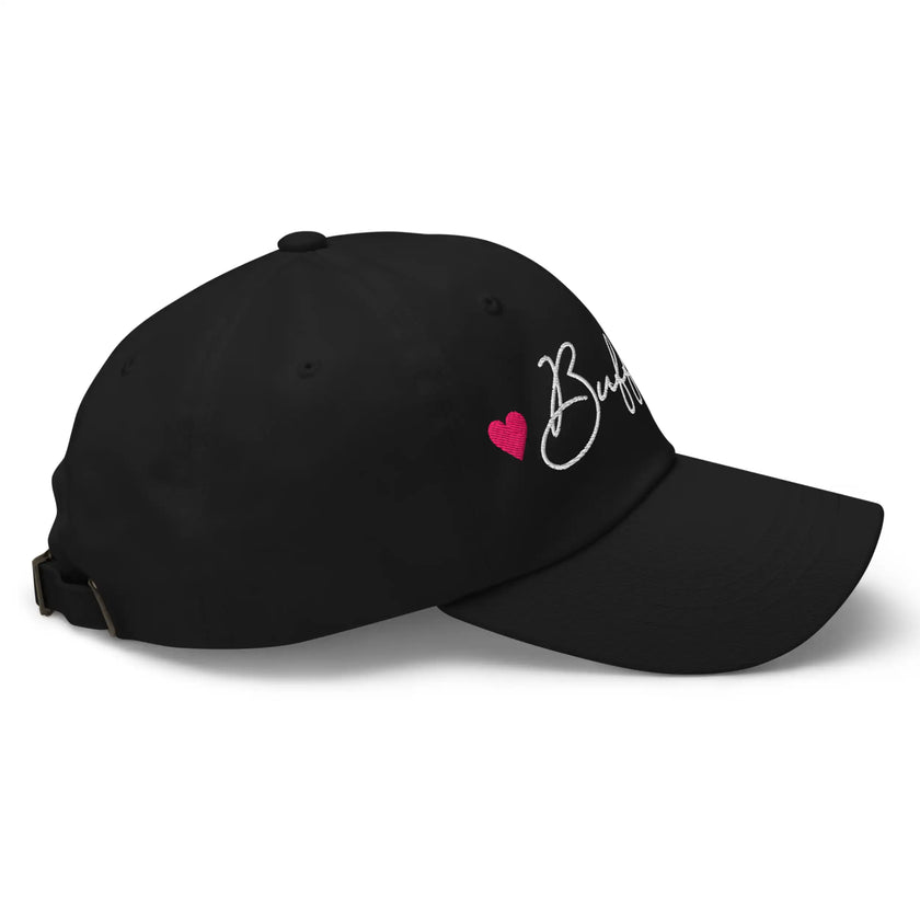Black dad hat right side view showing embroidered Buffalo script lettering with hot pink heart details.