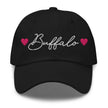 Black classic dad hat featuring embroidered Buffalo script lettering with hot pink hearts on each side, Buffalo city pride hat design.
