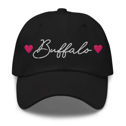 Black classic dad hat featuring embroidered Buffalo script lettering with hot pink hearts on each side, Buffalo city pride hat design.