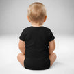 Back view of baby wearing black Buffalo hockey ‘Let’s Go Buffalo’ bodysuit with soft cotton fit and snap closure detail.