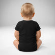 Back view of baby wearing black Buffalo hockey bodysuit with snap closure and soft cotton fit, Buffalo hockey themed baby apparel.
