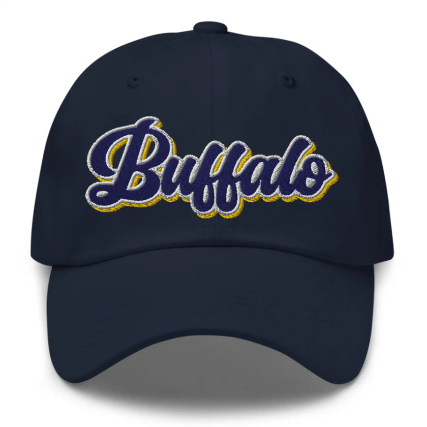 Navy dad hat featuring retro Buffalo hockey script lettering with blue white and gold colorblock embroidery, Buffalo hockey hat design.