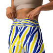Close-up of the waistband on blue and gold Buffalo hockey leggings, highlighting the detailed striped Buffalo print and fitted athletic design.