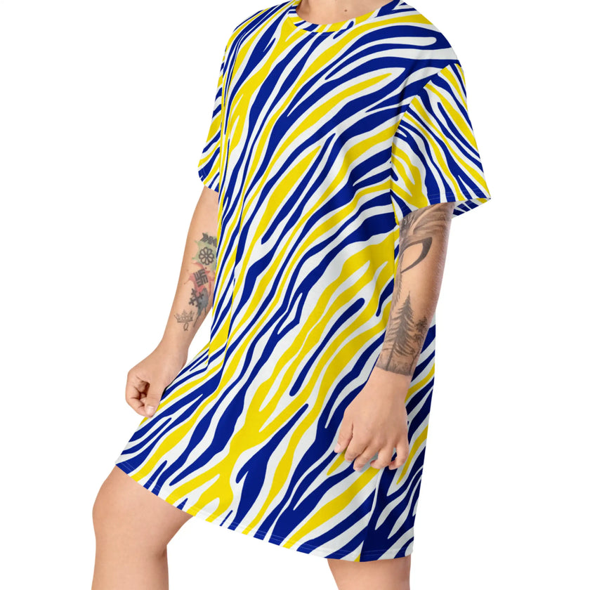 Left side view of oversized Buffalo hockey t-shirt dress featuring the original blue and gold signature stripes, relaxed silhouette, and bold statement style.