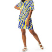 Woman posing in an oversized Buffalo hockey t-shirt dress featuring the signature blue and gold Buffalo stripe pattern, expressive fan fashion with a standout original look.