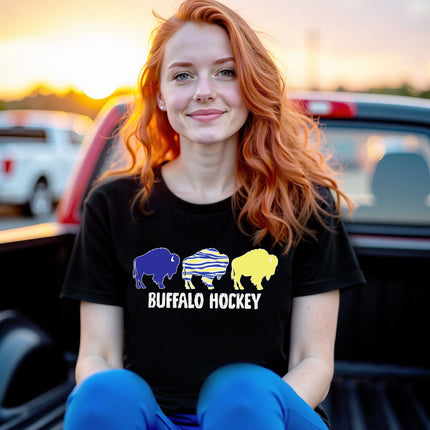 Female model wearing black Buffalo hockey t-shirt with trio buffalo silhouette design and distressed Buffalo Hockey lettering, casual fan outfit.