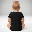 Back view of baby wearing black Buffalo Irish baby bodysuit with soft cotton fit and snap closure design, Irish pride Buffalo baby apparel.