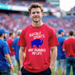 Man wearing a red Buffalo sports t-shirt featuring the humorous ‘Buffalo Sports Are Ruining My Life’ design with a bold blue buffalo graphic, capturing the highs and heartbreak of being a Buffalo fan.