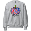 Grey Buffalo football fall sweatshirt showcasing a team-color striped pumpkin design in red white and blue with playful Let’s Go Buffalo script