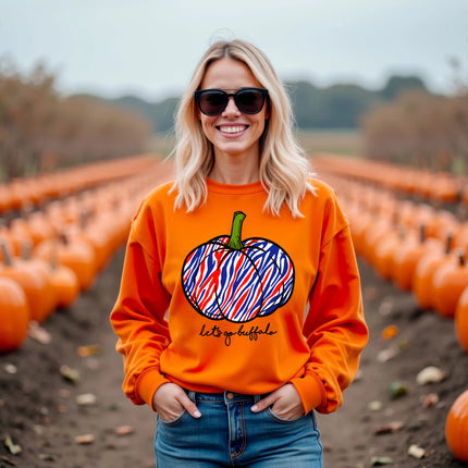 Woman wearing an orange Buffalo football Halloween sweatshirt featuring a red white and blue striped pumpkin and Let’s Go Buffalo script while enjoying a fall pumpkin patch.