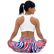 Woman sitting while wearing Buffalo stripes leggings featuring bold red white and blue team color pattern, unique Buffalo football inspired athletic wear.
