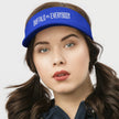 Woman wearing a blue Buffalo football golf visor featuring white ‘Buffalo vs. Everybody’ embroidery, sporty and stylish headwear for golf, sunshine, and game day.