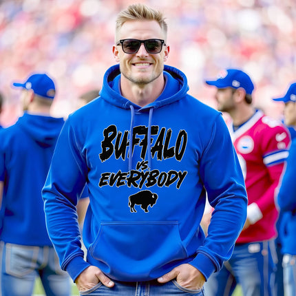 Male model wearing blue Buffalo football hoodie featuring ‘Buffalo vs. Everybody’ slogan in bold black lettering outlined in white with buffalo silhouette, relaxed game day style.