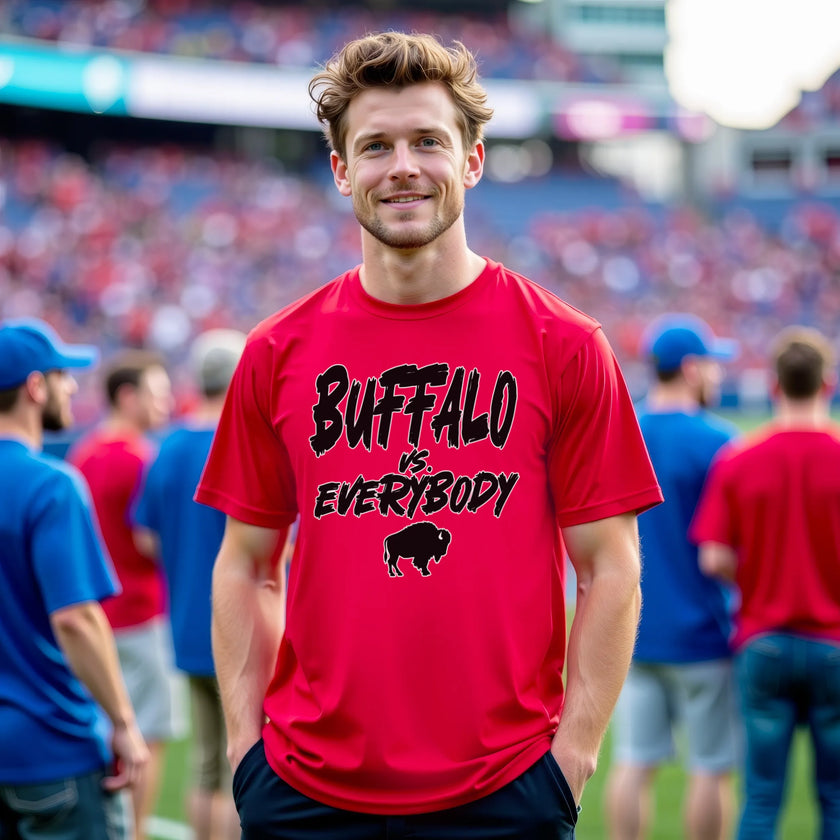 Male model wearing red Buffalo football tee with ‘Buffalo vs. Everybody’ statement in bold outlined lettering and buffalo silhouette graphic, spirited Buffalo fan shirt.