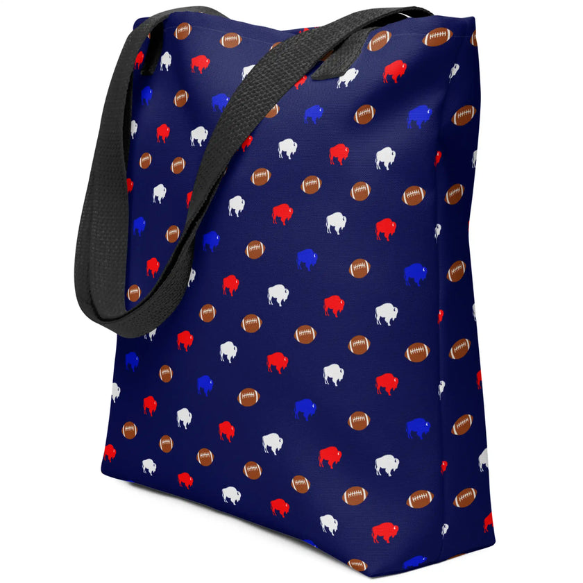 Side view of playful navy blue Buffalo football carryall bag showcasing the repeating pattern of colorful mini buffalo silhouettes and tiny brown footballs on an all-over print design.
