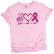 Pink “Peace, Love, Cure” t-shirt flat lay with pink tie-dye peace hand, double-heart, and glittery ribbon icons for breast cancer awareness