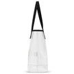 Side view of clear TPU Buffalo football stadium tote bag showing transparent durable construction with Buffalo football themed print, brown football graphic, and black handles.