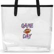 Close-up of clear TPU Game Day stadium tote bag featuring brown football design and bold red white and blue striped lettering on transparent durable material.