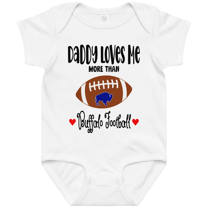 White baby bodysuit featuring the adorable phrase ‘Daddy Loves Me More Than Buffalo Football’ with a cute football buffalo graphic, red hearts, and playful Buffalo fan style.