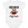 White baby bodysuit featuring the adorable phrase ‘Daddy Loves Me More Than Buffalo Football’ with a cute football buffalo graphic, red hearts, and playful Buffalo fan style.
