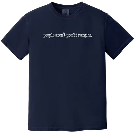 Navy “People Aren’t Profit Margins” t-shirt flat lay showcasing understated minimalist font and cause-based statement