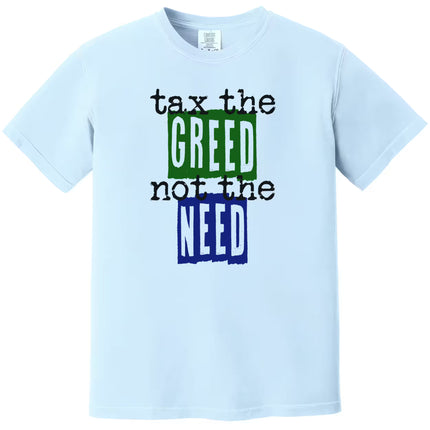 Blue “Tax the Greed, Not the Need” t-shirt flat lay highlighting bold blue and green letters with minimalist social justice design