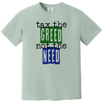 Green “Tax the Greed, Not the Need” t-shirt flat lay featuring bold letters and minimalist design for people-first advocacy